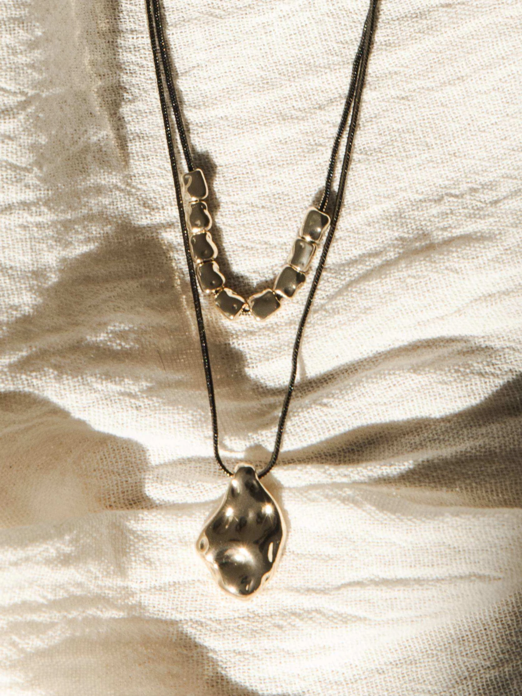 BLACK LAYERED CORD NECKLACE
